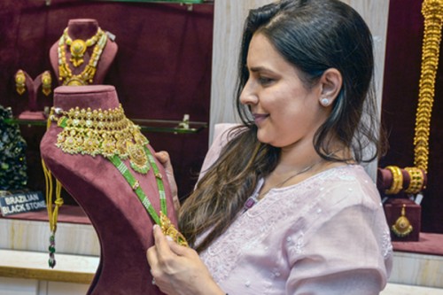 Gold and silver surge on safe haven demand, margin cut