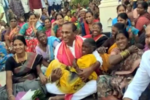 Telangana minister lifts elderly woman in arms during campaign